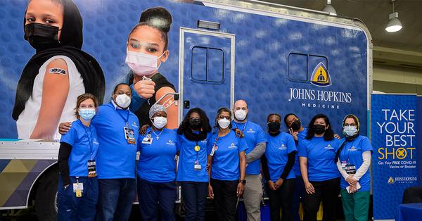 The Johns Hopkins Mobile Vaccine Team poses for a photo.